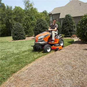 man riding a tractor